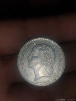 Obverse of 1945 French 5 Francs coin showing laurel-wreathed female profile and REPUBLIQUE FRANCAISE inscription