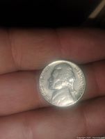 Obverse side of 1959 Jefferson nickel showing Thomas Jefferson's profile and inscriptions.