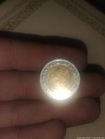 Front side showing profile with helmet and bi-metallic composition