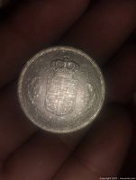 Obverse of 5 kroner coin showing Danish royal coat of arms, 1976 date, and denomination