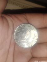 Image of the front side of the coin showing a swimmer engraving and inscription 'LIMITED EDITION', 'GREAT AMERICAN COIN COLLECTION', and 'NHLPA'.