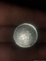 Coin front side showing RCMP officer on horseback.