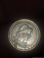 Obverse side of the 1919 coin showing a profile of a woman surrounded by stars.