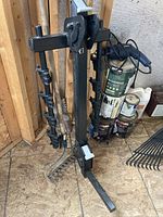 Photo showing the main vertical steel frame of the dual arm hitch mounted bike carrier, black with mounting hitch and support arms.