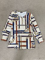 J. McLaughlin long-sleeve top front with white base and belt and chain print