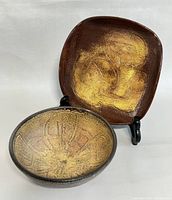 Two Theo & Susan Harlander pottery bowls displayed on white background