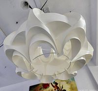 Underneath view of assembled lamp shade showing curved panels and ceiling mount
