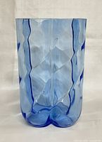 Front view of the light blue four-lobed vase showing form and color