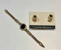 S.A.L bracelet and Carolina Herrera earrings displayed together on white background