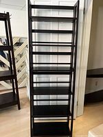 Front view of entire ladder shelf showing all six shelves and slim profile