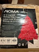 Box of 6 1/2 foot lighted pink bishop Christmas tree showing product details and lighting specifications.