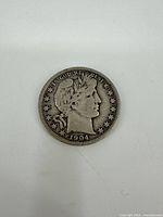 Obverse of 1904 Barber Half Dollar showing Liberty head, stars, and date.