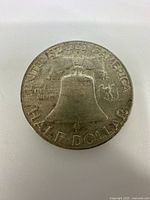 Reverse of the 1949 Franklin half dollar showing the Liberty Bell and an eagle with inscriptions.