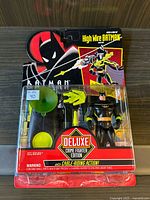 Front view of the Kenner High Wire Batman Deluxe Crime Fighter Edition action figure in original packaging showing the figure, grappling hook, cable, and colorful Batman graphics.