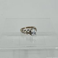 Front side view of the silver ring showing quartz stone and band design