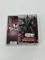 Spawn Reborn action figure in original packaging, showing front view of figure and branding.