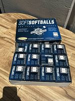Top view of the box labeled 'SOFT SOFTBALLS' containing 12 individual boxes.