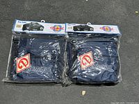 Photo showing two Diamond Pro Tote bags sealed in original packaging, side-by-side, with visible front logo and product labels.