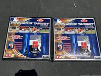 Front view of two boxed Franklin Pop-Up Pitchers Target To Go sets side by side on asphalt.