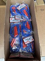 Multiple speed jump ropes packaged in plastic, showing blue ropes and red handles inside a cardboard box.