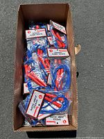 Box containing 40 individually packaged speed jump ropes with blue ropes and red handles.