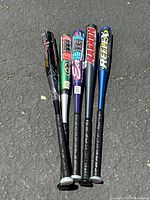 All five aluminum baseball bats shown side by side from barrel to handle, showing varied colors and brand labels.