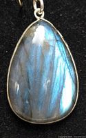 Front view of the teardrop labradorite pendant showing blue iridescence on the stone.
