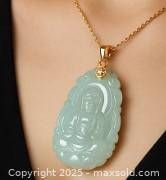 Pendant worn on a gold chain showing size and detail.