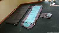 Both sleeping bags laid out side by side with stuff sack