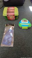 All three packaged camping accessories arranged on floor