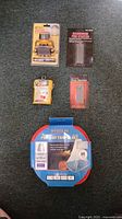 All five packaged camping accessories displayed