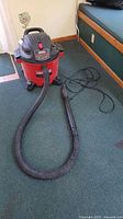 Full view of Craftsman shop vacuum with hose and cord