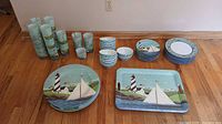 Full view of all dishware pieces arranged on floor