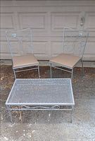 Full set showing two chairs and coffee table