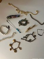 All eleven bracelets arranged on surface