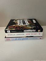 Stack of three cookbooks spine view