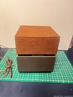 Single Electrohome 3591 speaker showing fabric grill, cabinet and attached wire
