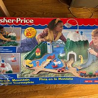 Front of Fisher Price Flip Track Mountain box showing assembled playset