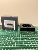 Paperclip holder beside original box