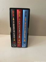 Spine view of all three hardcover books in slipcase