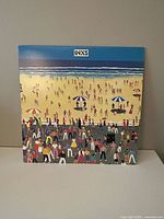 Front cover showing beach crowd artwork