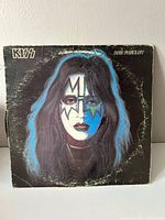 Front jacket showing Ace Frehley portrait, wear visible