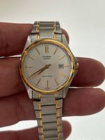 Front view of Casio two-tone wristwatch showing dial and bracelet