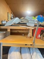 Full view of articulated clamp lamp on desk