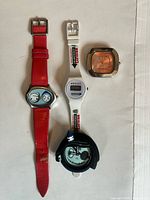 Group shot of four watches arranged vertically
