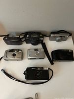 All seven cameras arranged on tabletop