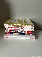 Stacked view of all six manga volumes showing spines