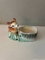 Front view showing fawn and planter