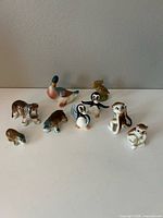 Group shot of all nine porcelain animal figurines