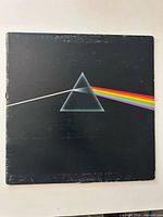 Front cover with prism artwork showing edge wear